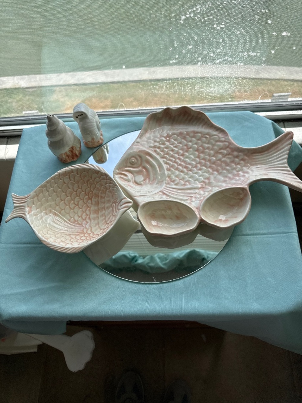 Pink fish, serving platters and salt and pepper shaker
